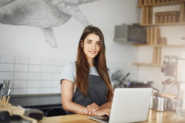 young business woman leading small business cafe with erp system