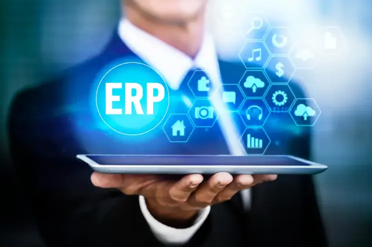 businessman with a tablet erp hologram 