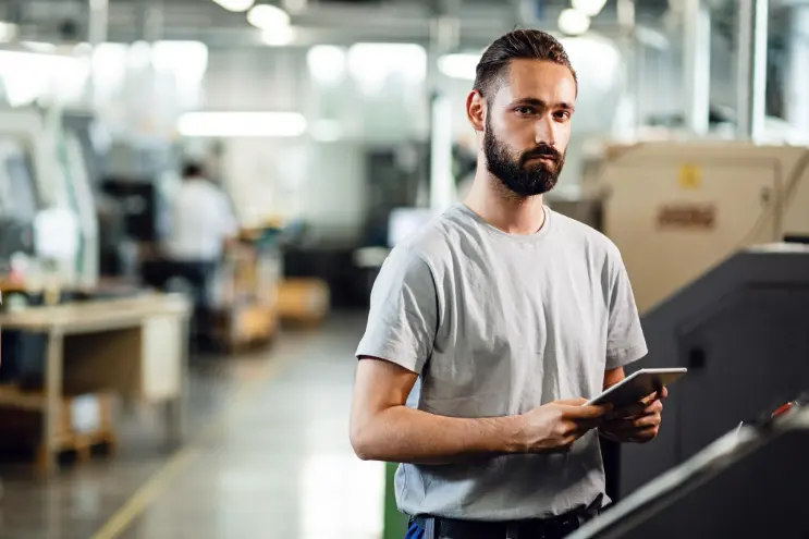 working man using manufacturing automation software